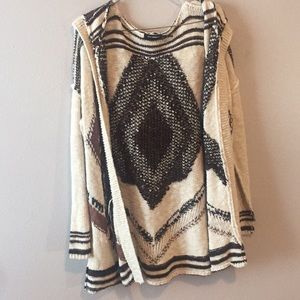 Black, brown, and cream cardigan with hood